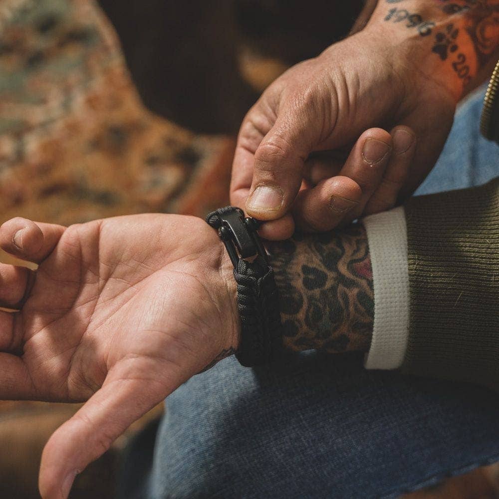 The Hero Company-Camo Paracord Bronze Flag Bracelet- Helps Pair Veterans With A Companion Dog- Faire