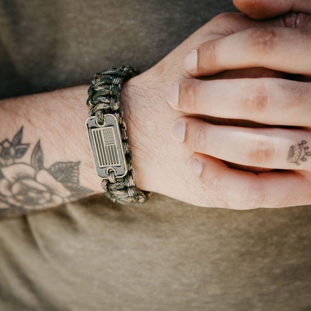 The Hero Company-Camo Paracord Bronze Flag Bracelet- Helps Pair Veterans With A Companion Dog- Faire