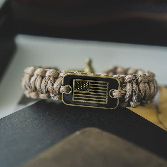 The Hero Company - The Hero Company- Desert Camo Paracord Bronze Flag Bracelet - Helps Pair Veterans With A Service Dog Or Shelter Dog -Faire