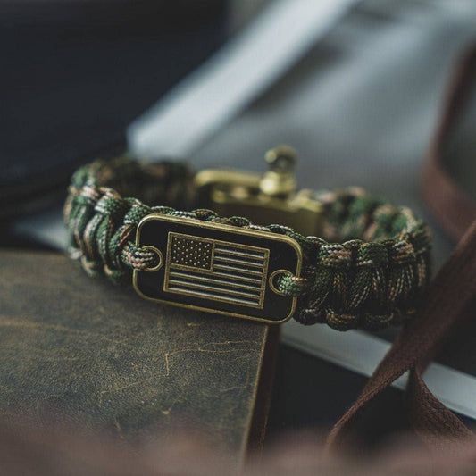 The Hero Company-Camo Paracord Bronze Flag Bracelet- Helps Pair Veterans With A Companion Dog- Faire